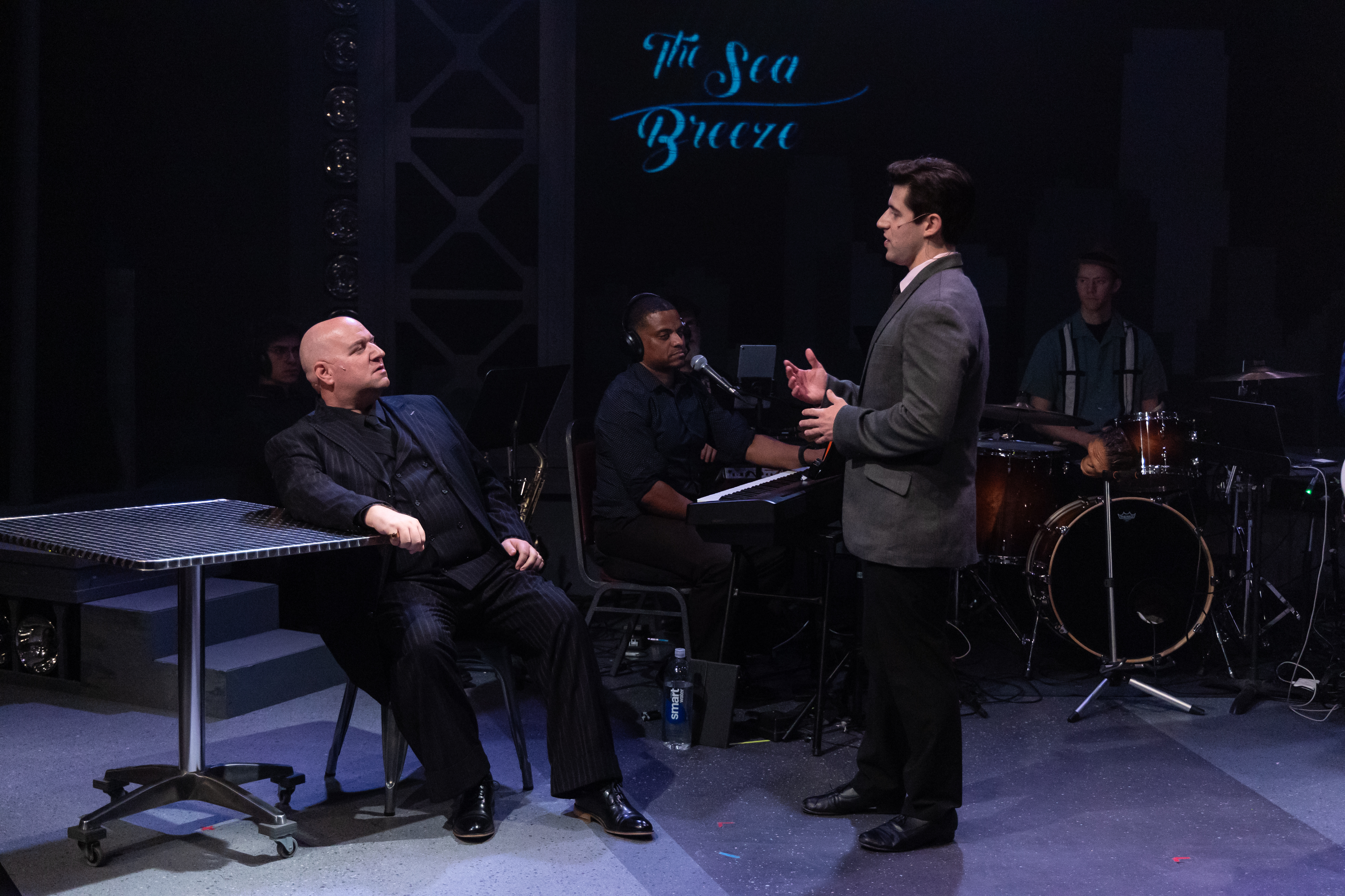 David Kincannon as Gyp DeCarlo speaking with Jake Bell as Frankie Valli.